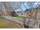 Charming homes with white picket fences and flowering trees line a peaceful street at 16504 Knox Run Rd, Huntersville, NC 28078