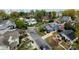 Aerial view of a quiet neighborhood with mature trees and well-maintained homes at 1703 Luther St, Charlotte, NC 28204