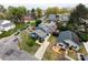 Aerial view of a beautiful home with a large yard and mature trees in a quiet neighborhood at 1703 Luther St, Charlotte, NC 28204