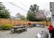 Backyard patio featuring an outdoor kitchen, built in grill, and dining area at 1703 Luther St, Charlotte, NC 28204
