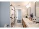 Modern bathroom featuring double sinks, vanity, marble countertops and glass shower at 1703 Luther St, Charlotte, NC 28204