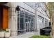 Modern building exterior featuring Waterbean Coffee shop, outdoor seating, and architectural details at 1703 Luther St, Charlotte, NC 28204