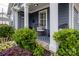 Inviting front porch with comfortable seating, stylish decor, and lush landscaping at 1703 Luther St, Charlotte, NC 28204
