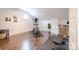 Bright home gym featuring an elliptical machine, free weights, and wood flooring at 1703 Luther St, Charlotte, NC 28204