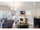 Cozy living room with a modern fireplace, comfortable seating, and ample natural light at 1703 Luther St, Charlotte, NC 28204