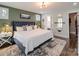 Serene main bedroom featuring a plush bed, stylish decor, and an en-suite bathroom at 1703 Luther St, Charlotte, NC 28204