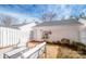 The backyard offers outdoor seating and landscaping that enhances the area's aesthetic appeal at 19915 Lamp Lighters Way, Cornelius, NC 28031