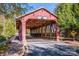 Exterior of historic covered bridge with wooden and metal beam construction at 19915 Lamp Lighters Way, Cornelius, NC 28031