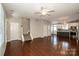 Open floor plan living area leads to the kitchen with hardwood floors at 19915 Lamp Lighters Way, Cornelius, NC 28031