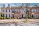 Charming brick townhomes offer curb appeal with landscaped front yards and inviting entrances at 19915 Lamp Lighters Way, Cornelius, NC 28031