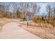 Paved walking trail through a natural wooded area at 19915 Lamp Lighters Way, Cornelius, NC 28031