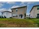 Exterior view of the home showcasing a spacious backyard, ideal for outdoor activities and relaxation at 2131 Belterra Dr, Charlotte, NC 28216