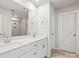 Bright bathroom featuring a double sink vanity with modern fixtures and framed shower with clear glass door at 2131 Belterra Dr, Charlotte, NC 28216