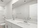 Bright bathroom featuring a double sink vanity with modern fixtures and a shower and tub combo at 2131 Belterra Dr, Charlotte, NC 28216
