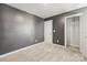 Bedroom with neutral carpet and grey walls, featuring a closet with wire shelving at 2131 Belterra Dr, Charlotte, NC 28216