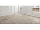 The bedroom features carpeted floors, neutral paint colors, bright light from two windows at 2131 Belterra Dr, Charlotte, NC 28216