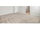 The bedroom has neutral paint colors, carpeted floors, baseboard trim and an ensuite bathroom at 2131 Belterra Dr, Charlotte, NC 28216