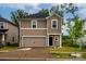Charming two-story home with a welcoming front porch, well manicured lawn, and attached garage in a nice community at 2131 Belterra Dr, Charlotte, NC 28216