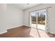 Living room with hardwood floors and sliding glass doors leading to the outside at 2131 Belterra Dr, Charlotte, NC 28216