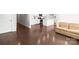 Open concept living area featuring hardwood floors that leads to a kitchen with white cabinets at 2131 Belterra Dr, Charlotte, NC 28216