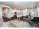 Open-concept living space with modern decor, a neutral color palette, hard-wood flooring, and great natural light at 2131 Belterra Dr, Charlotte, NC 28216
