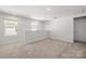 The loft features carpeted floors, bright light, and neutral paint colors at 2131 Belterra Dr, Charlotte, NC 28216