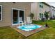 Cozy patio area with rocking chairs on a patterned rug, perfect for relaxing and enjoying the outdoors at 2131 Belterra Dr, Charlotte, NC 28216