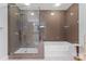 Modern bathroom featuring a glass-enclosed shower and separate soaking tub for a spa-like experience at 222 S Caldwell St # 2008, Charlotte, NC 28202