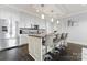 Modern kitchen featuring white cabinetry, stainless steel appliances, and large island at 222 S Caldwell St # 2008, Charlotte, NC 28202