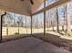 Covered back porch with a view of the backyard and a newly installed wooden fence for privacy at 2328 Kingsburry Rd, York, SC 29745
