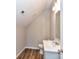 An upstairs bathroom features wood-look floors, a modern vanity, and excellent lighting at 2328 Kingsburry Rd, York, SC 29745