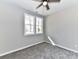 Neutral bedroom with carpet, ceiling fan, and two windows providing natural light at 2328 Kingsburry Rd, York, SC 29745