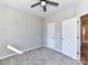 Bedroom featuring carpet, a ceiling fan, and two doors, one leading to the hallway at 2328 Kingsburry Rd, York, SC 29745