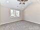 Vaulted ceiling bedroom with modern ceiling fan and natural light from double hung windows at 2328 Kingsburry Rd, York, SC 29745