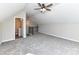 A bonus room with plush gray carpeting, a vaulted ceiling, and an attached bathroom offers flexible living space at 2328 Kingsburry Rd, York, SC 29745
