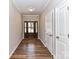 A welcoming entryway featuring wood-look floors, neutral walls, and a front door with glass panes at 2328 Kingsburry Rd, York, SC 29745