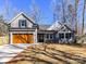 Charming gray home featuring a two-car garage, a well-manicured lawn, and a welcoming front entry at 2328 Kingsburry Rd, York, SC 29745