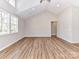 Spacious living room with wood-look floors, a vaulted ceiling, and plenty of natural light from multiple windows at 2328 Kingsburry Rd, York, SC 29745