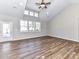 Bright living room with high ceilings, wood-look floors, recessed lighting, and abundant natural light at 2328 Kingsburry Rd, York, SC 29745