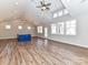 Open-concept living room featuring luxury vinyl flooring, high ceilings, and a kitchen island at 2328 Kingsburry Rd, York, SC 29745
