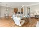 Spacious living room with hardwood floors, neutral decor, and open layout to the kitchen at 261 Crownsgate Ct, Charlotte, NC 28207