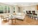 Open-concept living area with hardwood floors, modern furnishings, and access to the kitchen and dining area at 261 Crownsgate Ct, Charlotte, NC 28207