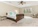 Cozy main bedroom with a large window and neutral carpet at 261 Crownsgate Ct, Charlotte, NC 28207
