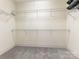 Spacious walk-in closet with wire shelving offers ample storage for clothing and accessories at 261 Crownsgate Ct, Charlotte, NC 28207