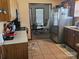 Efficient kitchen layout with stainless steel appliances, neutral countertops, and tile flooring at 2630 Sloan Dr, Charlotte, NC 28208