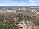 Expansive aerial view of a secluded property nestled among trees, showcasing its unique location and surrounding landscape at 265 River Run Rd, Statesville, NC 28625