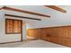 Finished attic space with exposed wooden beams, wooden shelving, and a light carpet at 265 River Run Rd, Statesville, NC 28625