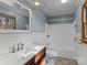 Bathroom with a wooden vanity and a shower-tub combination with nice finishes at 265 River Run Rd, Statesville, NC 28625