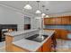 Spacious kitchen with cooking island and eat-in bar with views into other rooms at 265 River Run Rd, Statesville, NC 28625