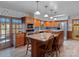 Eat-in kitchen features custom cabinets, granite countertops, stainless appliances and tile backsplash at 265 River Run Rd, Statesville, NC 28625